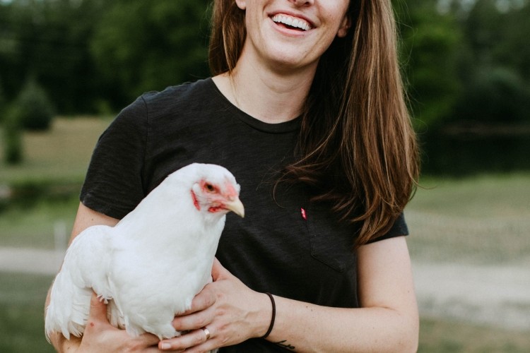 Headshot of Courtney Miller holding a Chicken