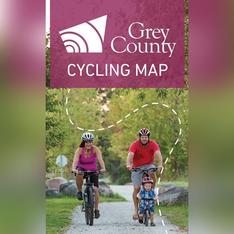 Cover of a cycling map with a family of cyclists.