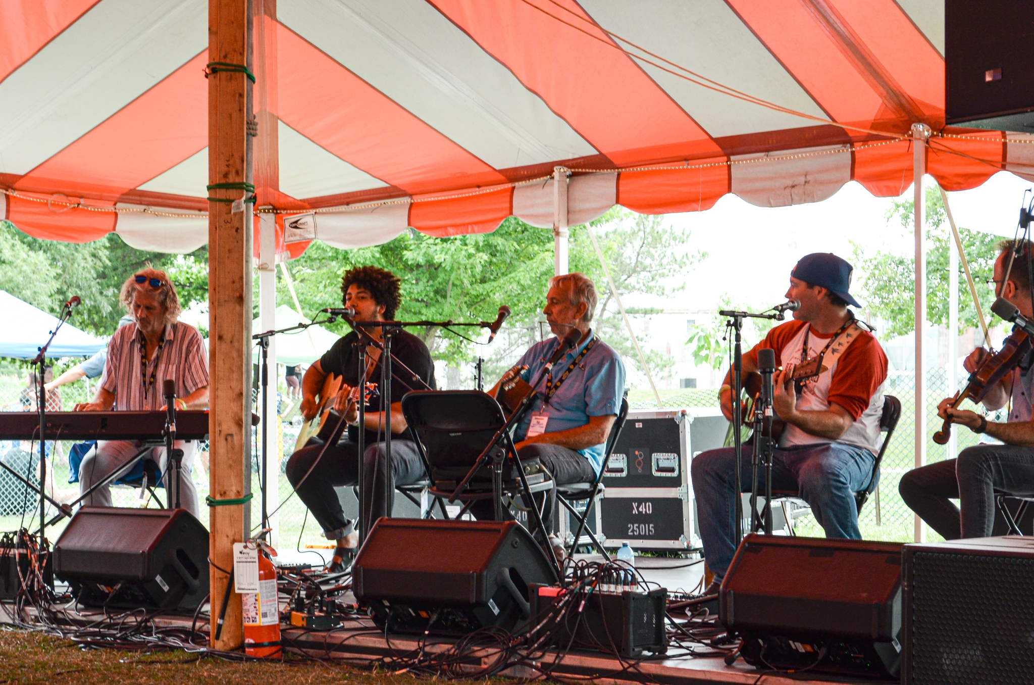 Band playing music under tents
