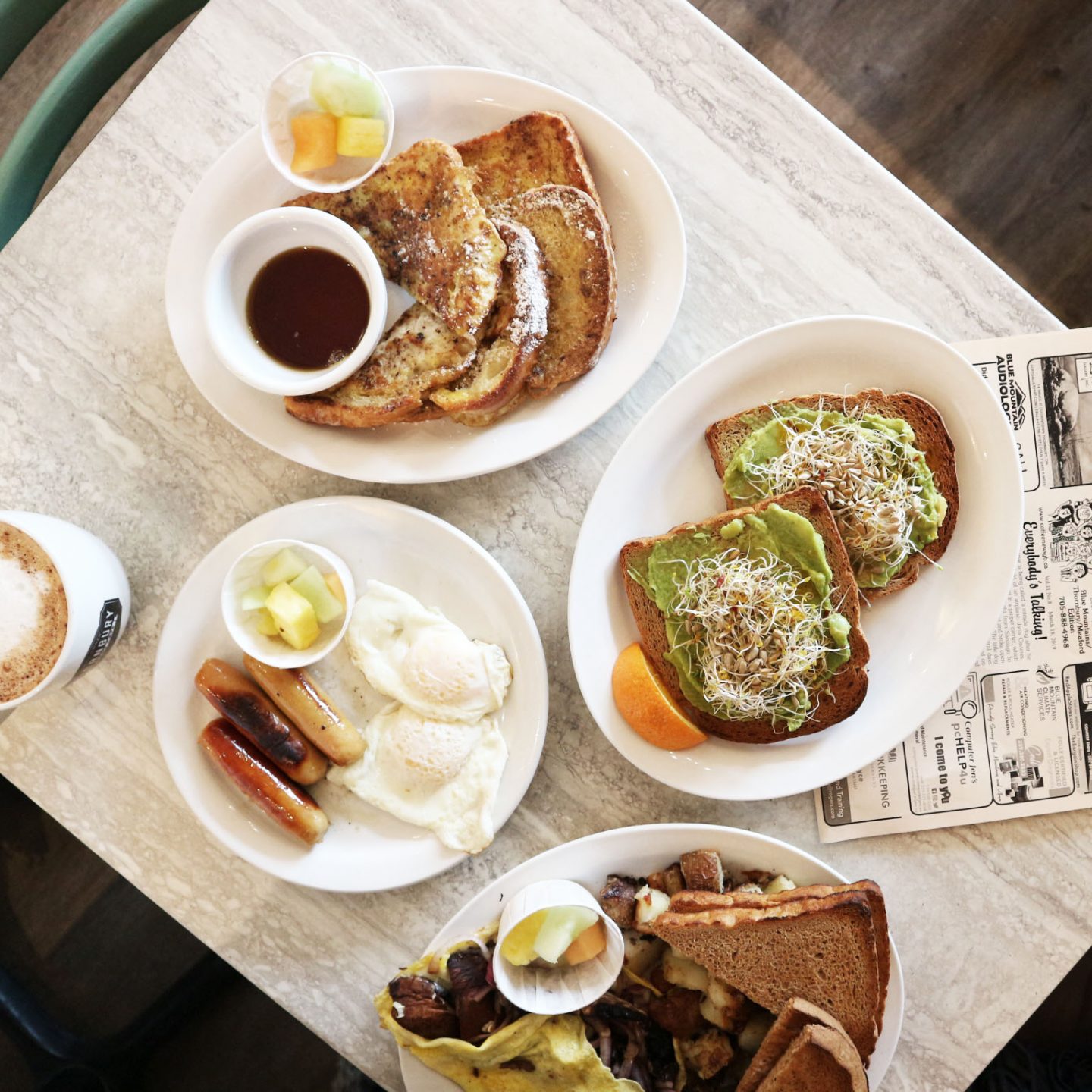 Top down view of four breakfast dishes.