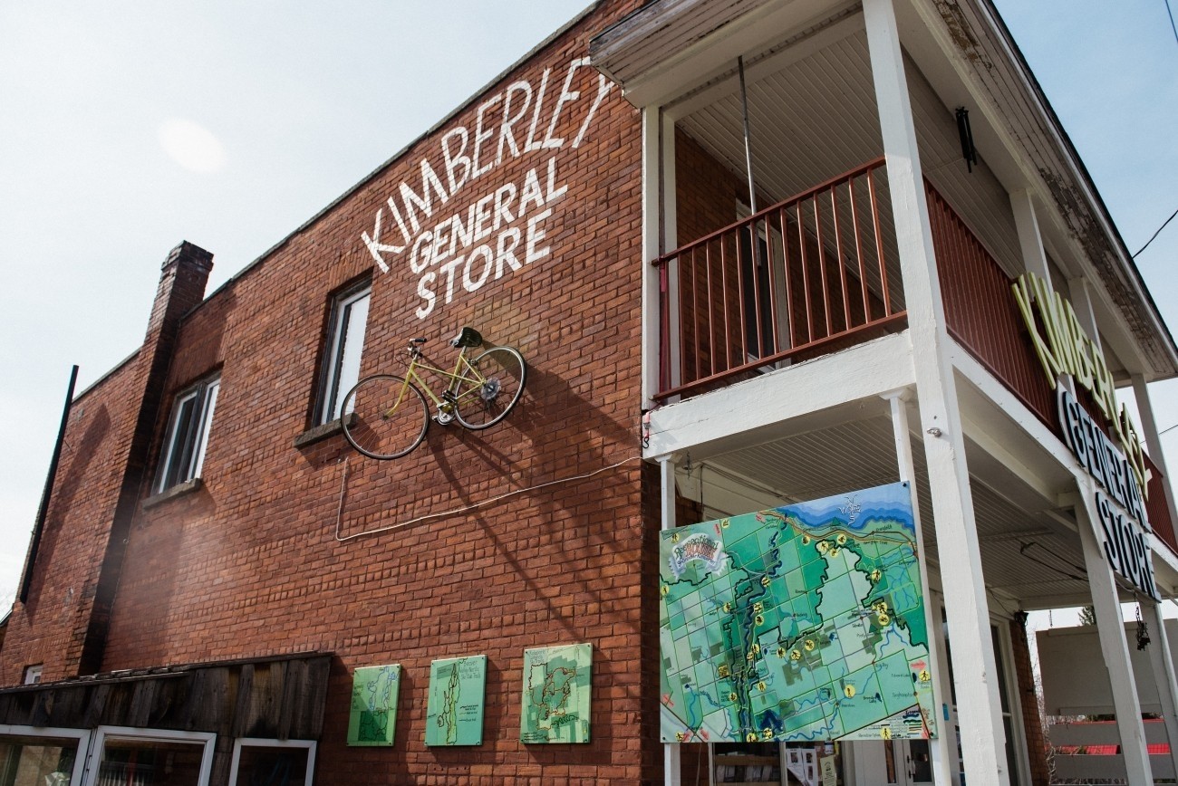 Exterior of brick store - a bicycle is mounted on the wall.