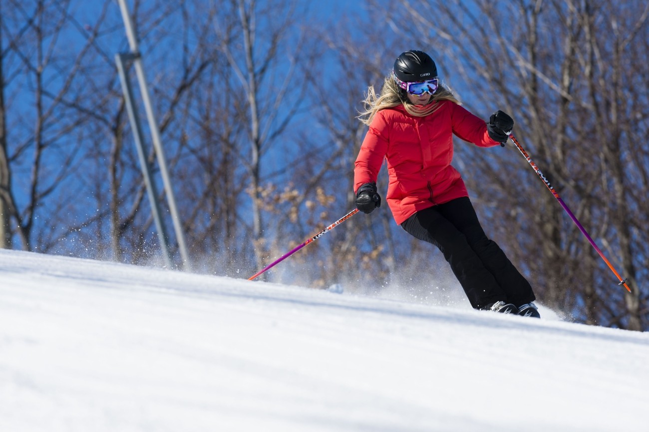 a woman downhill skiing