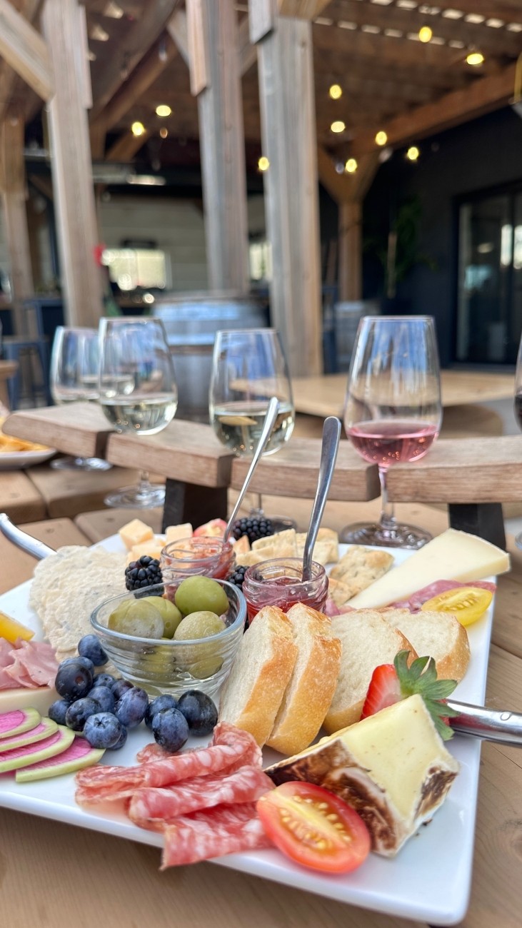 a table with wine glasses and food