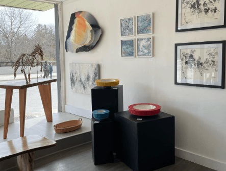 art gallery with paintings and sculptures