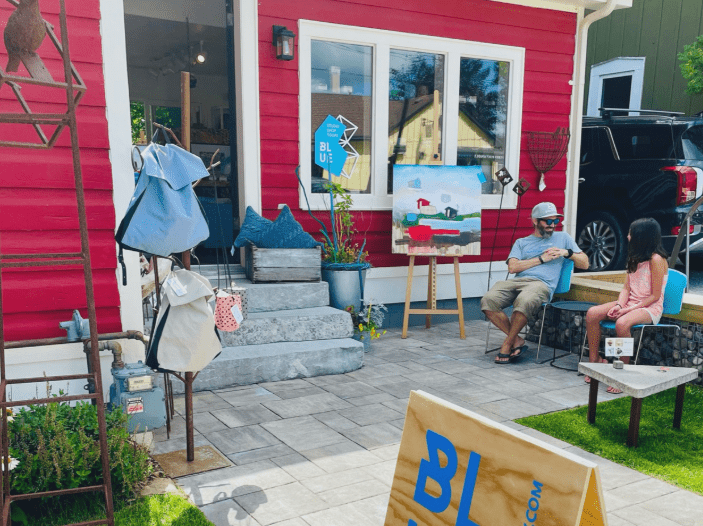 outdoor patio beside a building with bright red siding.