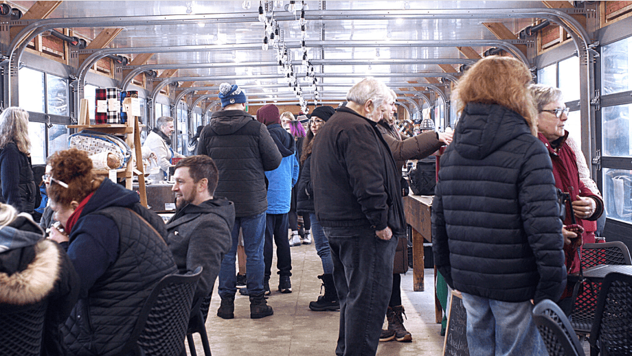 a crowd of people at a market 