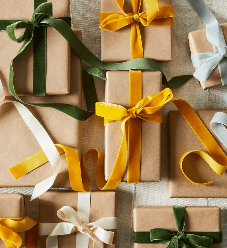 Top down view of several gift boxes with ribbons.