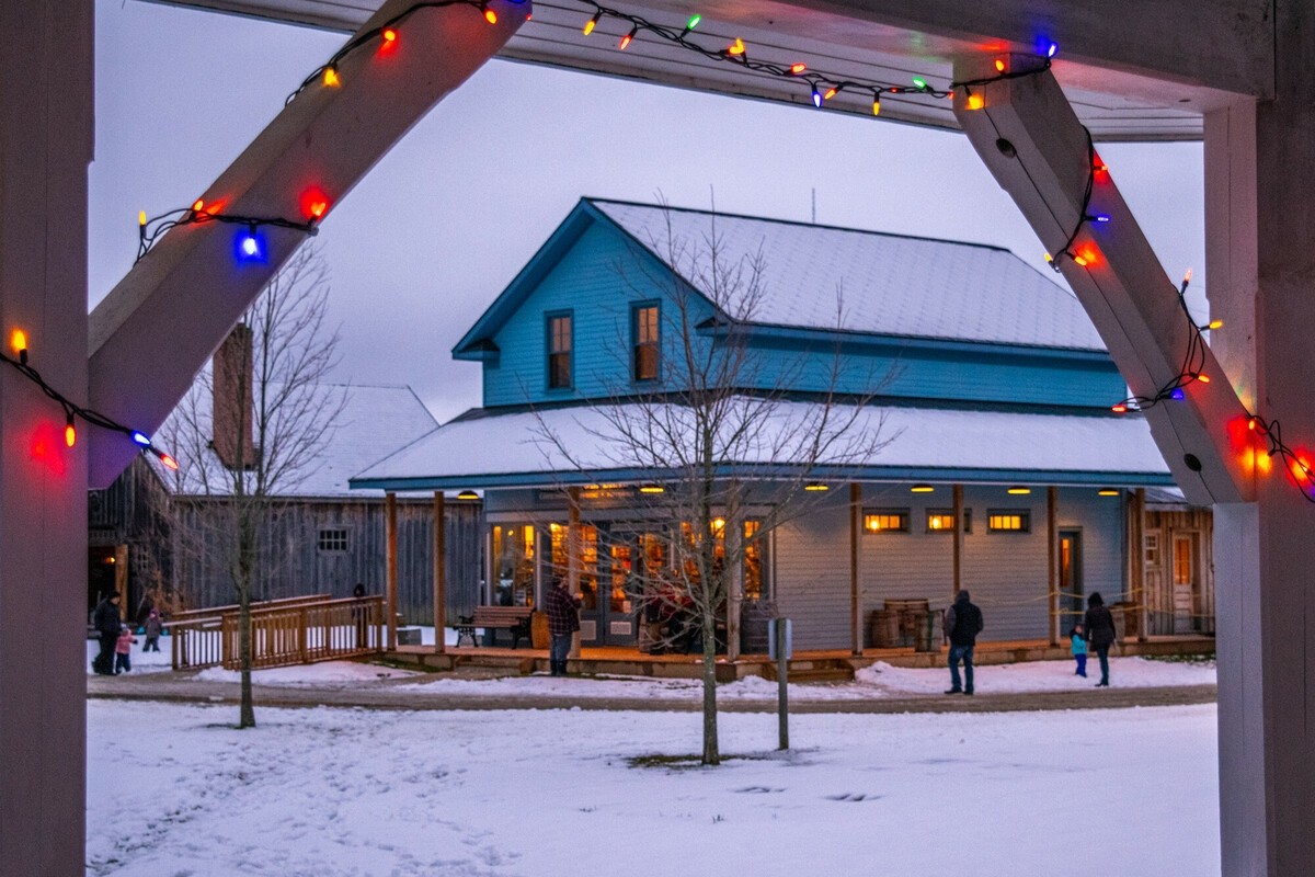 christmas lights strung around the Moreston Village buildings