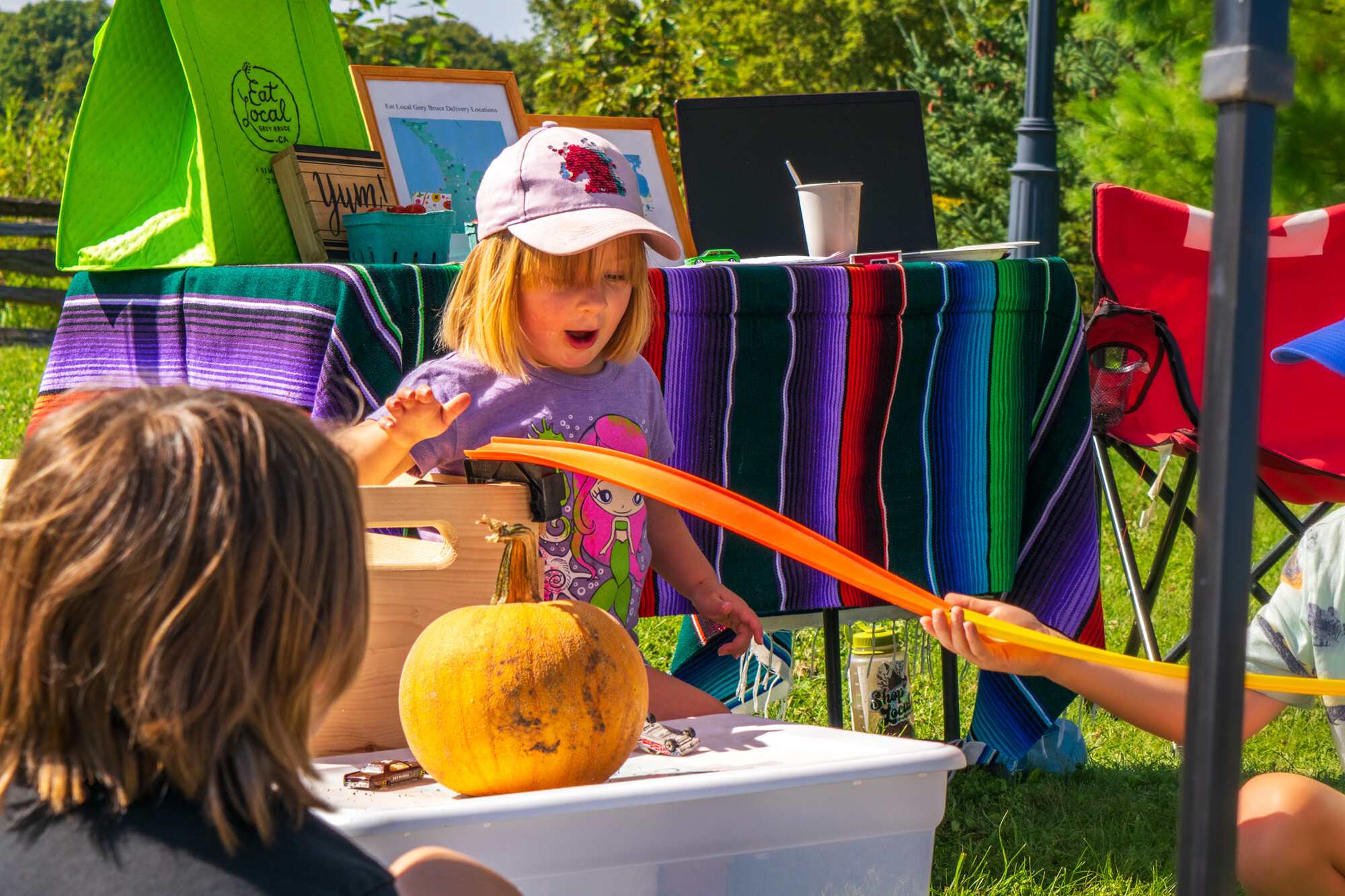 A child enjoys play at an outdoor event.