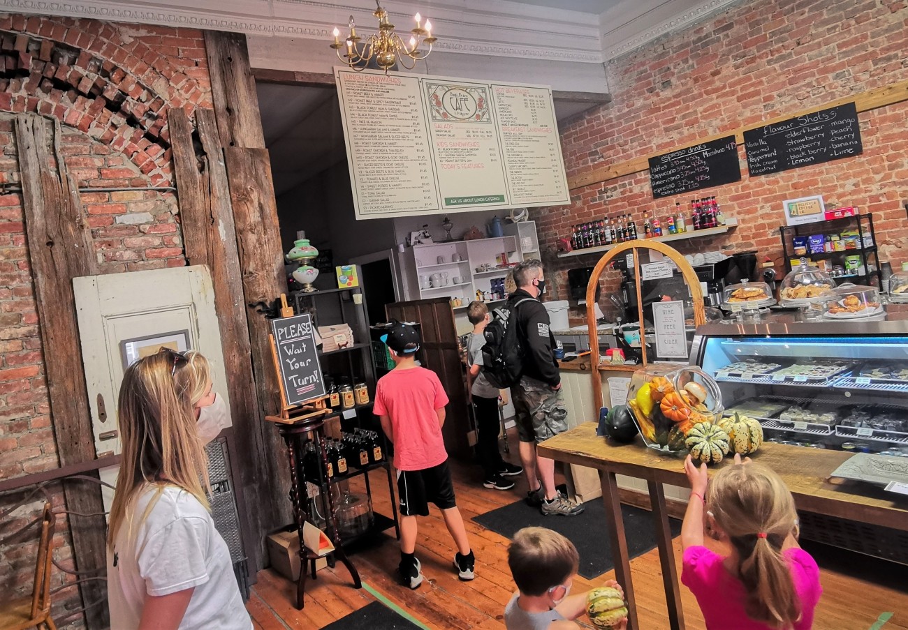 Several people inside a cafe.