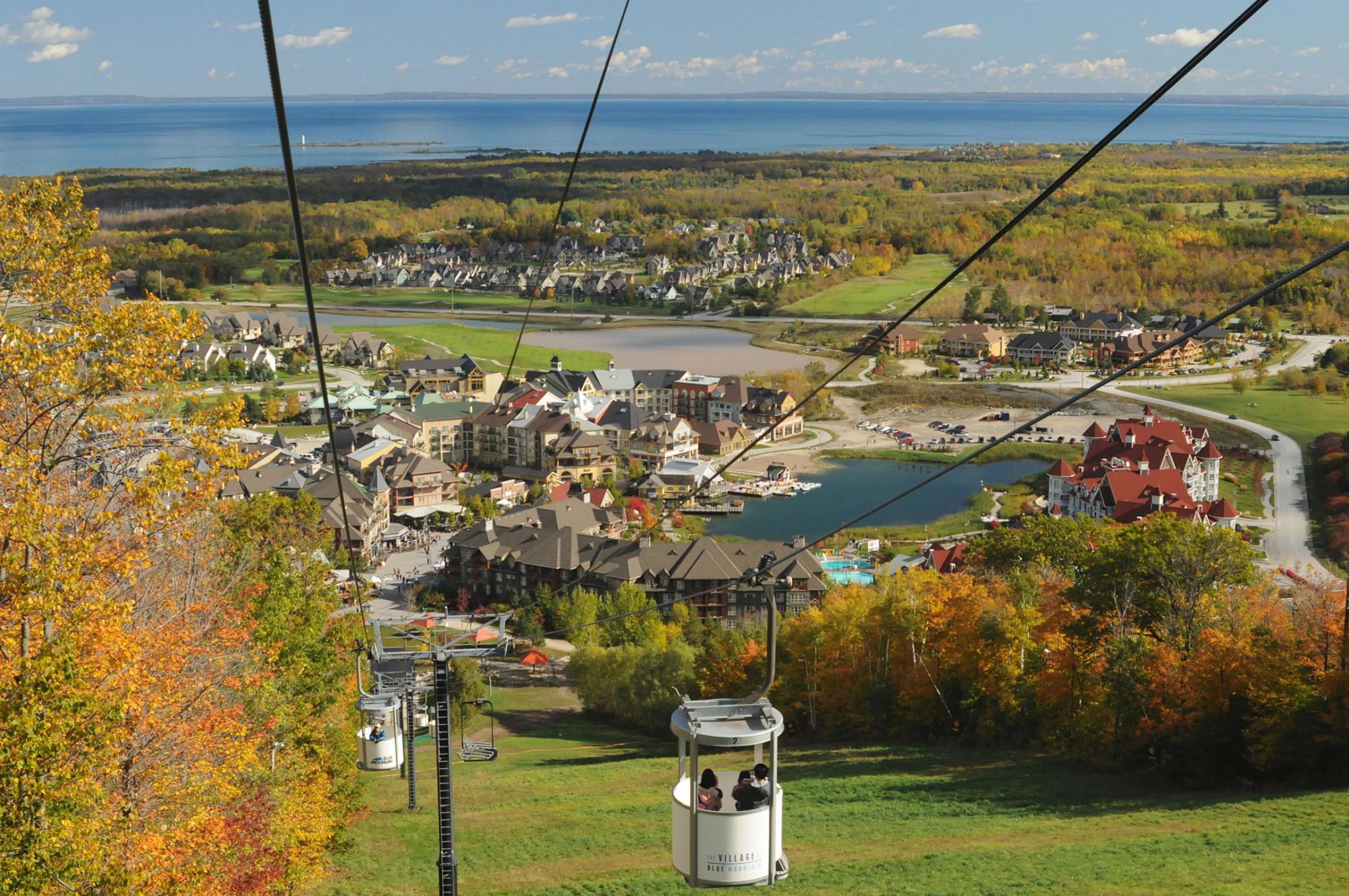 A gondola above a slope.